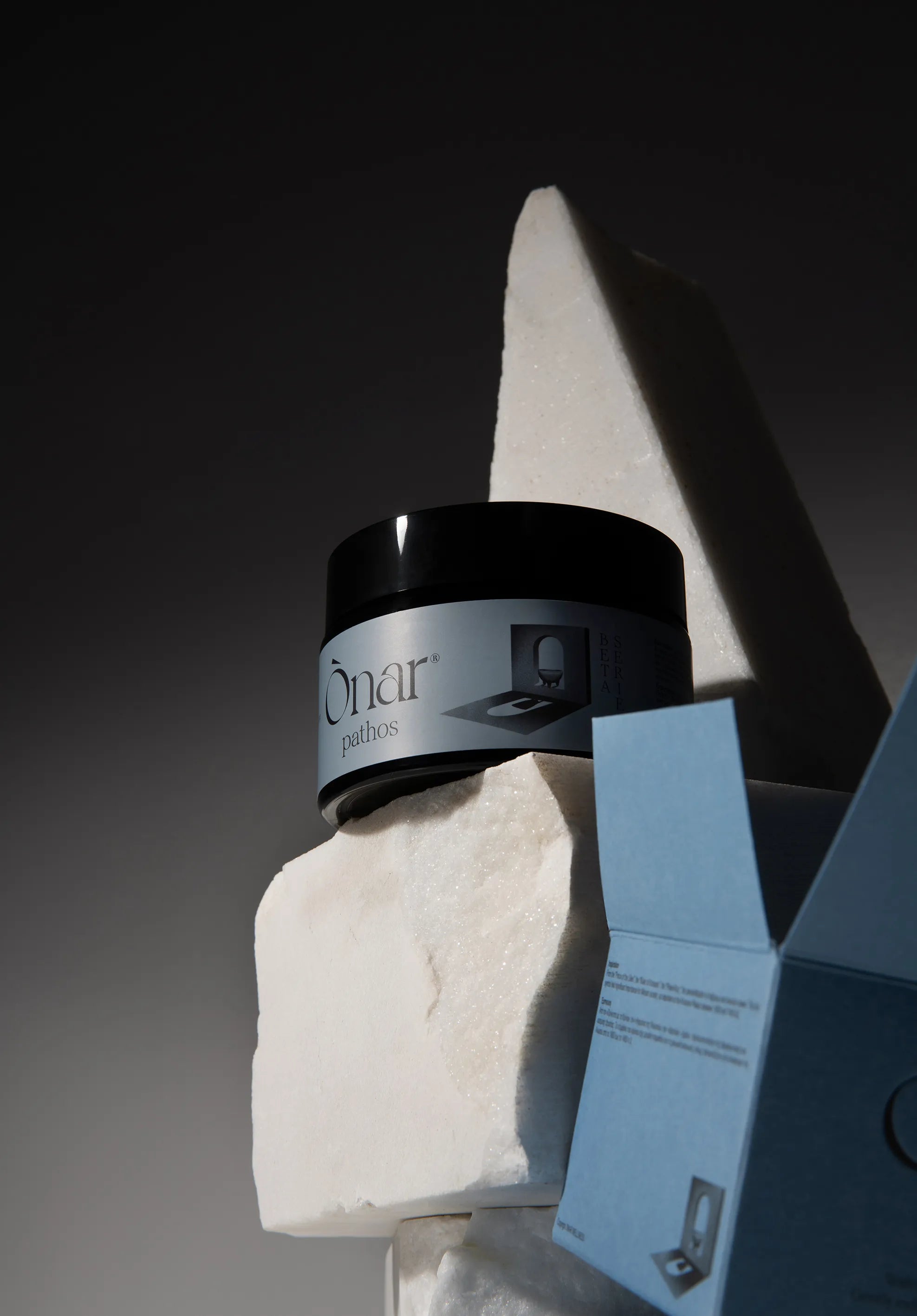 ONAR PATHOS GREEK PRODUCTS on a stone surface with a dark background